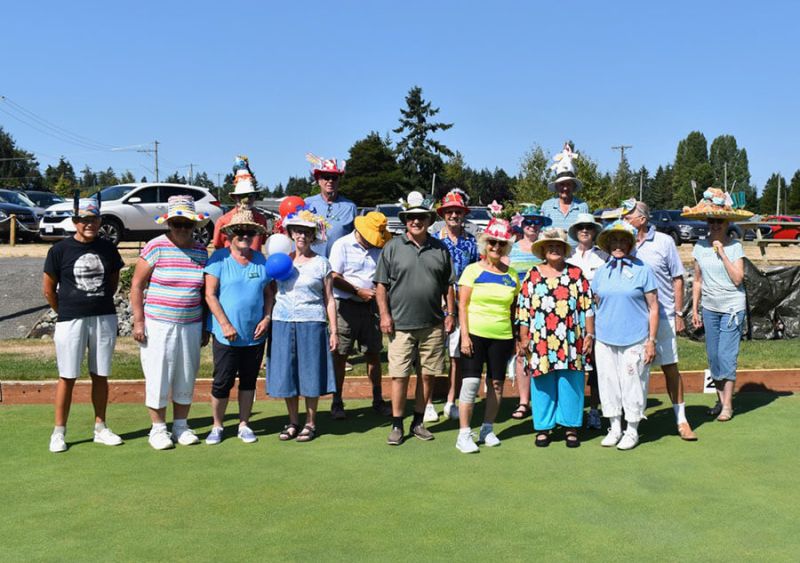 Parksville Lawn Bowling Club members smiling for camera with hats on