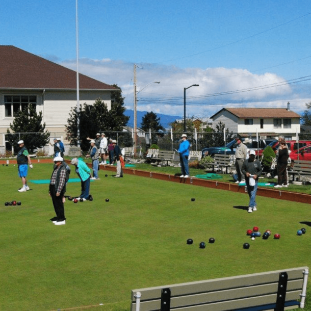 Parksville Lawn Bowling Club members lawn bowling by the building